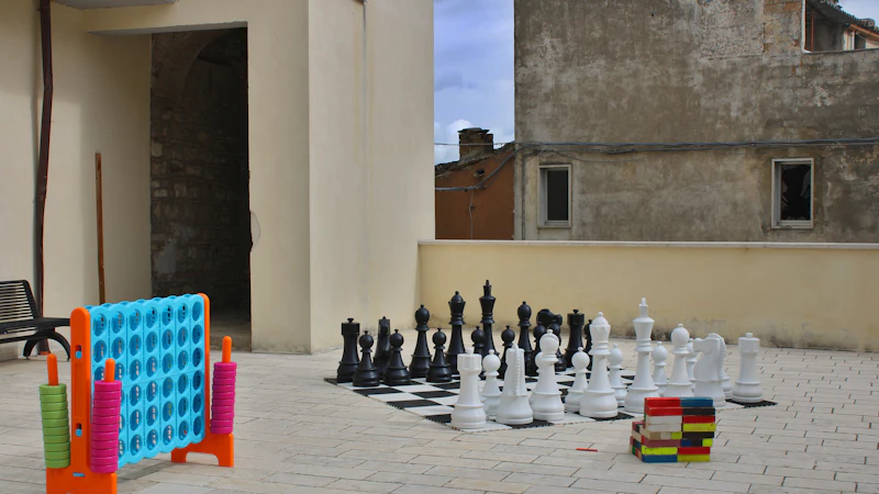Giant connect four, chess and jenga ready to play on a courtyard